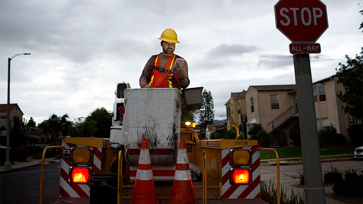 Worker installs connected technology